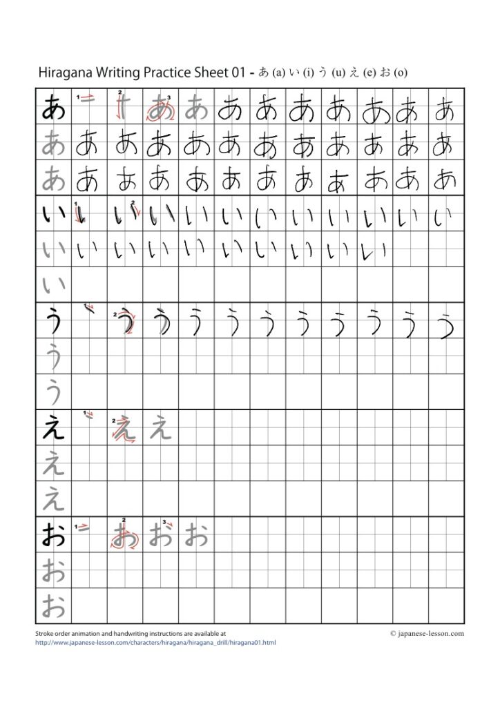 A child tracing Japanese characters on a worksheet decorated with autumn leaves.
