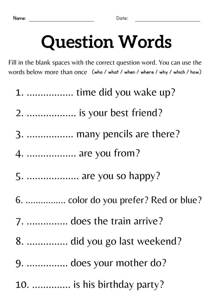Teacher and child sitting together at a table discussing a worksheet