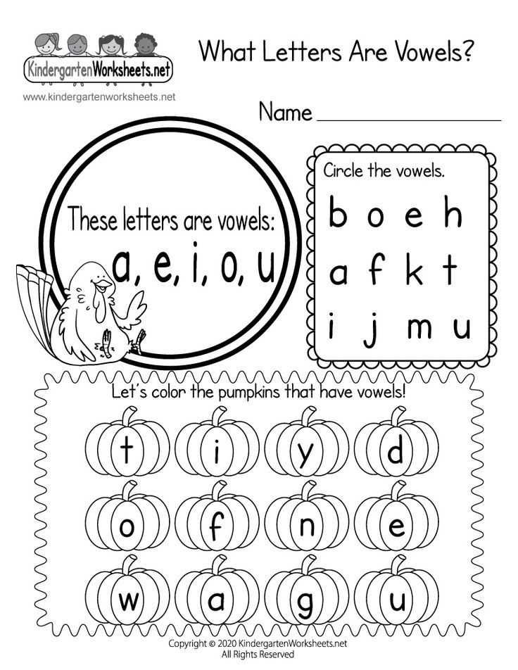 A colorful set of markers and an educational worksheet on a wooden table.