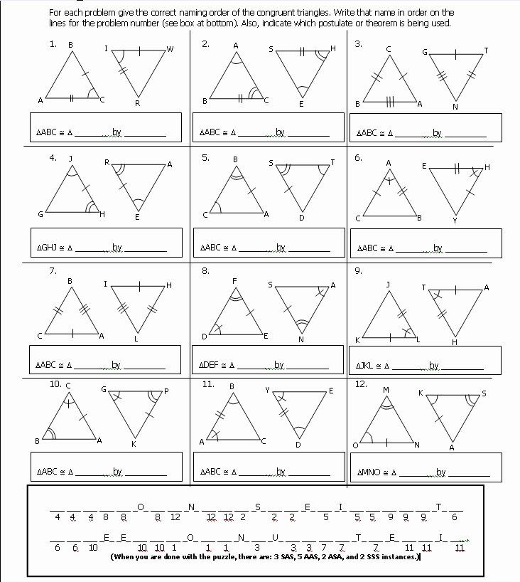 Construction paper triangles cut out and stacked on a wooden desk