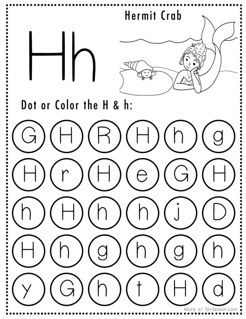 A young child pointing at a worksheet filled with illustrations of colorful hats
