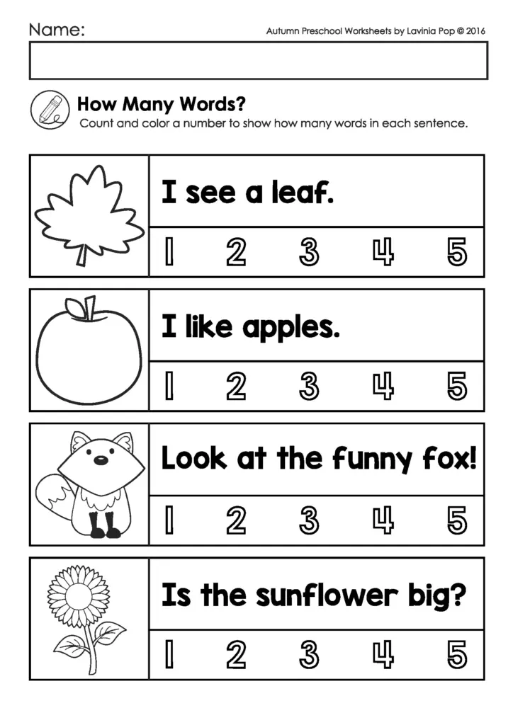Parent and child working together on a seasonal science worksheet at a table