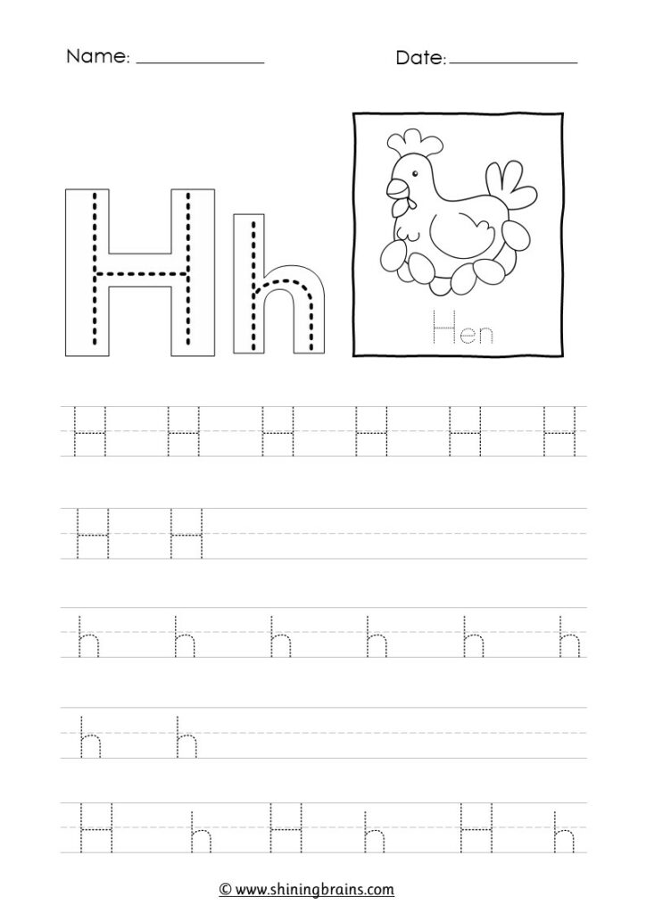 Close up of a child drawing houses on a piece of paper