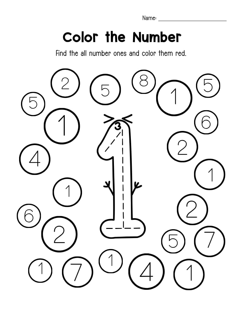 A young child carefully tracing the number one on a printed activity sheet