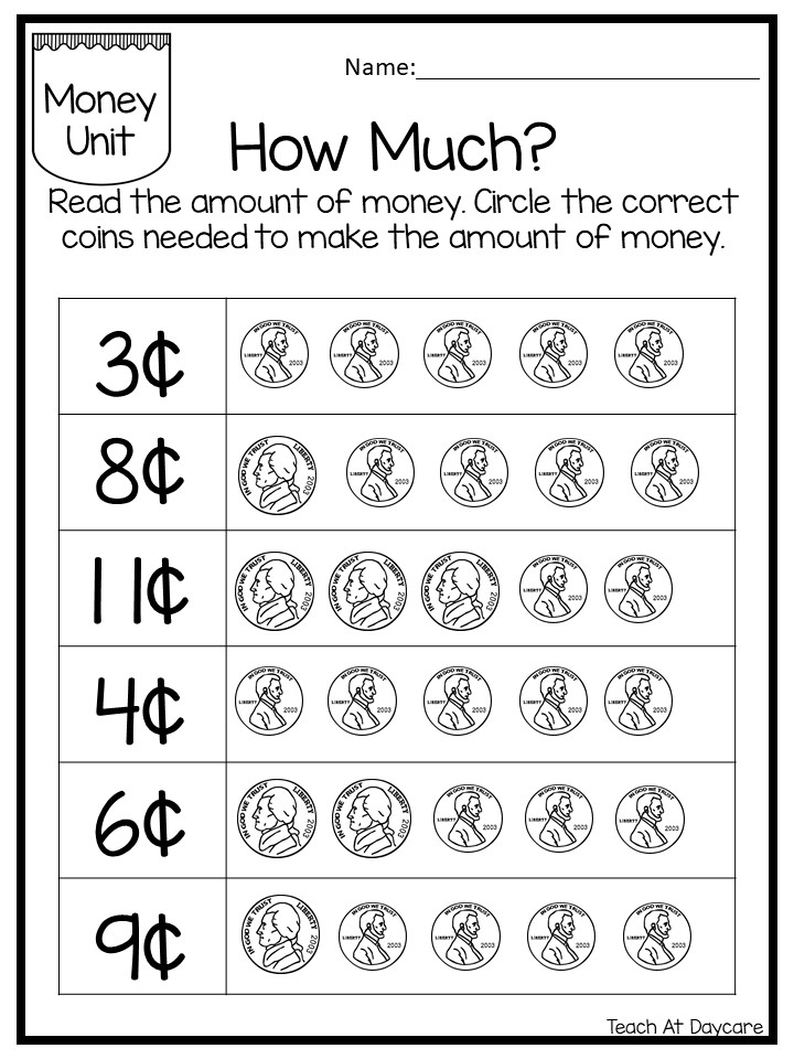 Teacher pointing at a printed math worksheet during a lesson